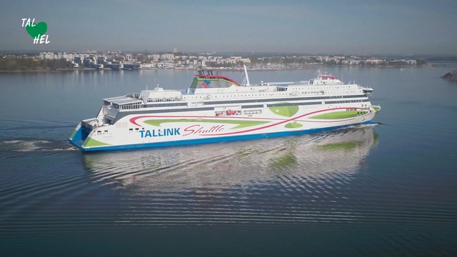 Video Reference: Vehicle, Water transportation, Ferry, Boat, Motor ship, Ship, Watercraft, Speedboat, Naval architecture, Mode of transport, Water, Outdoor, Sitting, Green, Large, Small, Body, Ocean, White, Old, Floating, Traveling, Beach, Riding, Blue, Sky, Lake, Text, Day