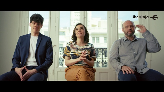Video Reference: Conversation, Sitting, Adaptation, Event, Photography, White-collar worker, Happy, Person, Man, Indoor, Window, People, Standing, Woman, Looking, Group, Couple, Posing, Holding, Table, Military, Suit, Cake, Train, Food, Television, Wedding, Room, Computer, Clothing, Human face, Smile, Text