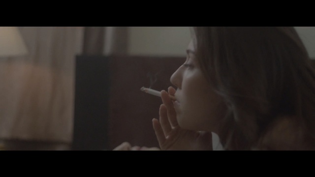 Video Reference: nose, girl, darkness, chin, screenshot, smoking, mouth, scene, human, jaw