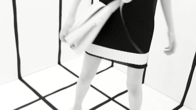 Video Reference: white, clothing, black, black and white, photograph, furniture, footwear, monochrome photography, chair, standing