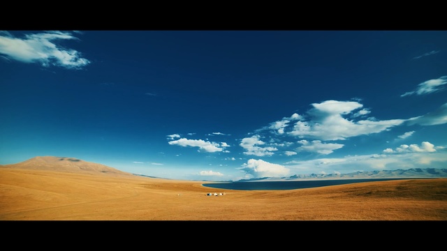 Video Reference: sky, cloud, ecosystem, horizon, grassland, atmosphere, daytime, plain, hill, ecoregion