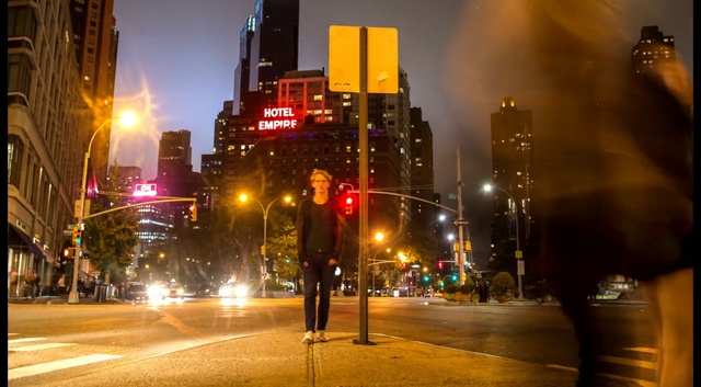 Video Reference: business district, city, intersection, night, urban, building, architecture, cityscape, skyscraper, skyline, buildings, downtown, Person
