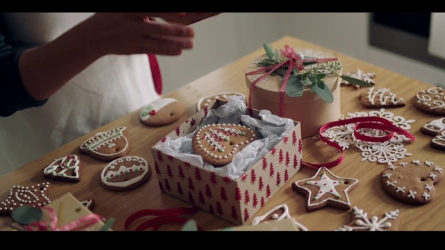 Video Reference: Sugar paste, Food, Sweetness, Cake decorating, Icing, Dessert, Buttercream, Baking, Cake, Royal icing, Indoor, Table, Person, Coffee, Plate, Sitting, Tray, Cutting, Woman, Chocolate, Holding, Kitchen, Birthday, Knife, Man, Pink, Toppings, White, Birthday cake, Baked goods, Snack, Muffin, Wedding cake, Pastry, Candle