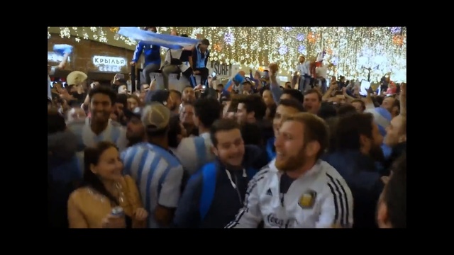 Video Reference: Crowd, People, Social group, Community, Event, Audience, Public space, Youth, Fun, Protest, Person, Indoor, Photo, Man, Front, Group, Sitting, Monitor, Large, Woman, Standing, Screen, Holding, Room, Table, Computer, Playing, Young, Television, Human face, Clothing, Text