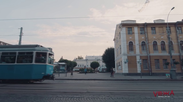 Video Reference: Transport, Mode of transport, Town, Urban area, Street, Vehicle, Architecture, City, Downtown, Tram