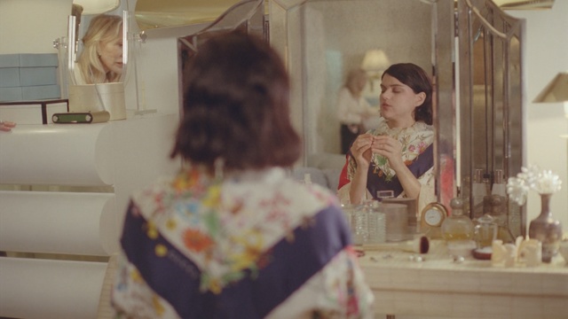 Video Reference: skin, room, textile, dress, girl, interior design, vintage clothing, furniture, ceremony, Person