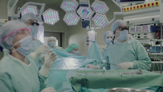 Video Reference: Surgeon, Medical procedure, Operating theater, Hospital, Medical, Scrubs, Medical equipment, Medical glove, Room, Service