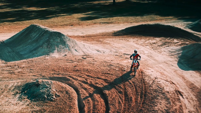 Video Reference: sky, sand, soil, terrain, geological phenomenon, rock, extreme sport, geology, landscape, tree, Person
