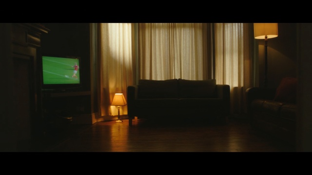 Video Reference: Room, Light, Lighting, Furniture, Sky, Interior design, Floor, House, Night, Flooring, Indoor, Table, Sitting, Small, Glass, Living, Large, Desk, Dark, Screen, Computer, Wooden, Laptop, Water, Standing, White, Couch, Curtain, Chair, Sofa bed, Studio couch, Vase, Coffee table, Bed, Loveseat