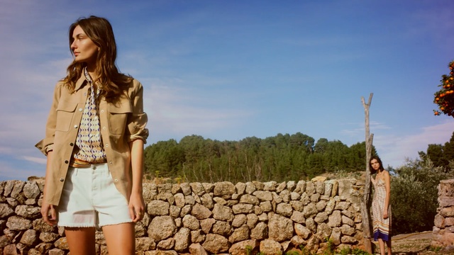 Video Reference: sky, girl, tree, vacation, landscape, tourism, grass, rock, Person