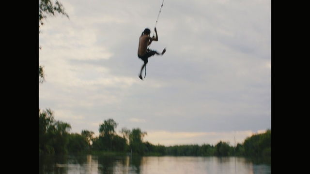 Video Reference: Jumping, Adventure, Extreme sport, Wakeboarding, Recreation, Water, Bungee jumping, Tree, Flip (acrobatic), Sports, Person