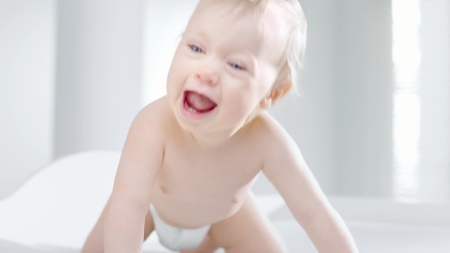 Video Reference: Child, Skin, Face, Baby, Toddler, Facial expression, Beauty, Blond, Cheek, Smile