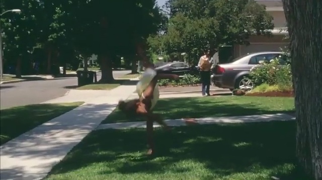 Video Reference: Lawn, Asphalt, Public space, Grass, Tree, Yard, Walkway, Sidewalk, Property, Mode of transport, Person