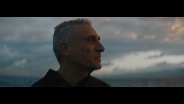 Video Reference: Sky, Photograph, Horizon, Head, Human, Chin, Male, Photography, Cloud, Forehead, Man, Person, Looking, Photo, Front, Holding, Clouds, Standing, Dark, Cloudy, Wearing, Monitor, Screen, Mountain, Phone, Computer, Television, Water, Remote, Flying, Airplane, Video, Room, Human face, Screenshot, Text, Portrait, Distance
