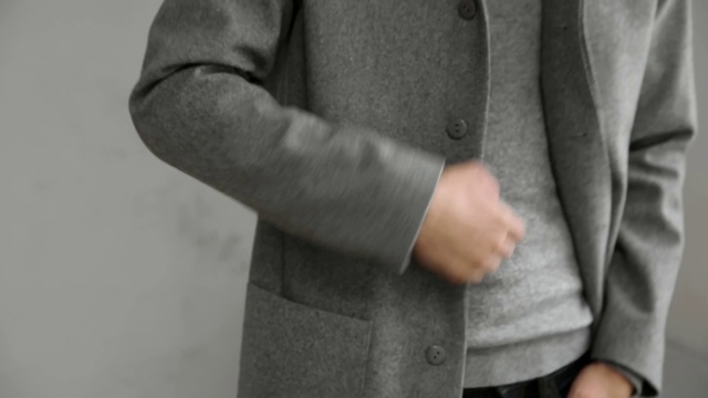 Video Reference: Suit, Outerwear, Finger, Hand, Arm, Jacket, Sleeve, Formal wear, Gesture, Blazer, Person