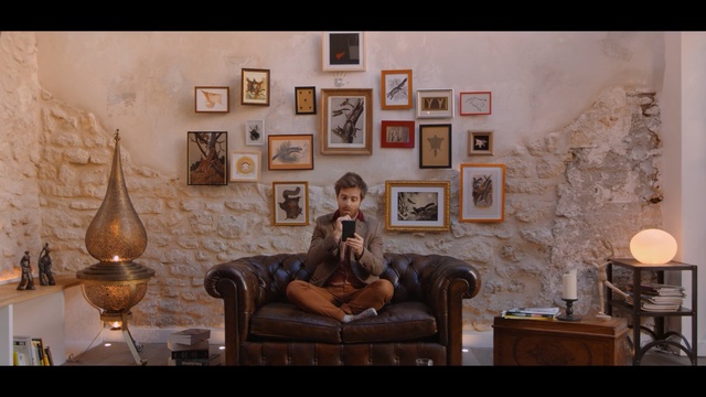 Video Reference: Room, Living room, Furniture, Couch, Interior design, Wall, Photography, Stock photography, Table, Sitting, Person