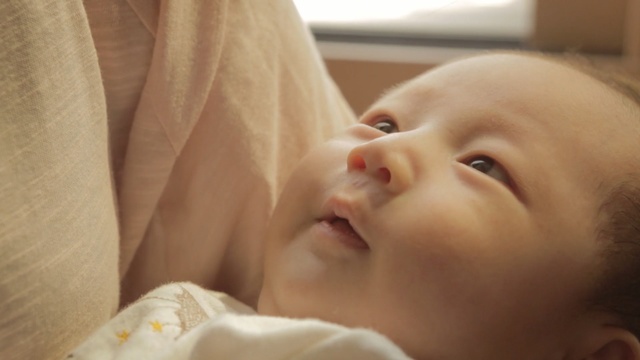 Video Reference: infant, child, face, skin, nose, cheek, close up, lip, mouth, hand