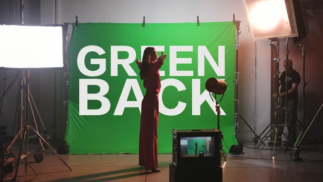 Video Reference: green, stage, film studio, performance, technology, studio, event, advertising, performance art, Person