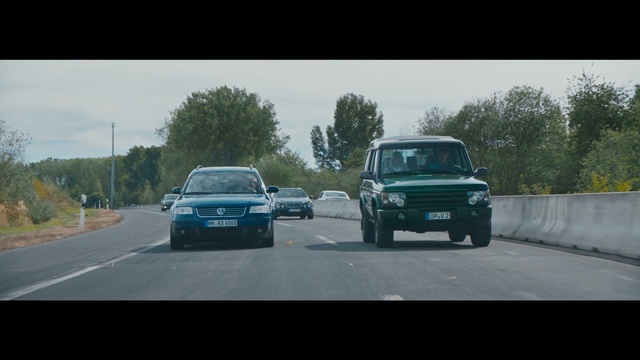 Video Reference: Land vehicle, Vehicle, Car, Mode of transport, Asphalt, Classic car, Road, Vaz-2101, Sedan, Outdoor, Scene, Highway, Street, Driving, Traveling, Light, Green, Truck, Traffic, Man, Red, Riding, City, Jumping, White, Bus, Ramp, Sign, Motorcycle, Parked, Standing, Doing, Snow, Tree, Sky, Wheel, Way, Text, Auto part