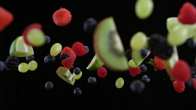 Video Reference: Macro photography, Plant, Food, Still life photography, Photography, Fruit, Sweetness, Space, Person, Indoor, Cake, Table, Decorated, Small, Black, Birthday, Sitting, Made, White, Red, Plate, Brush, Holding, Standing, Blue