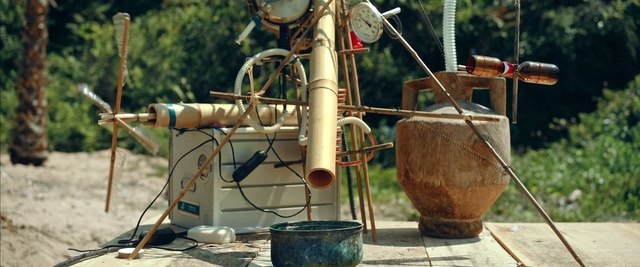 Video Reference: , Person, Outdoor, Table, Sitting, White, Standing, Plate, Wine, Water, Red, Field, Street, Group, Man, Tree, Pipe