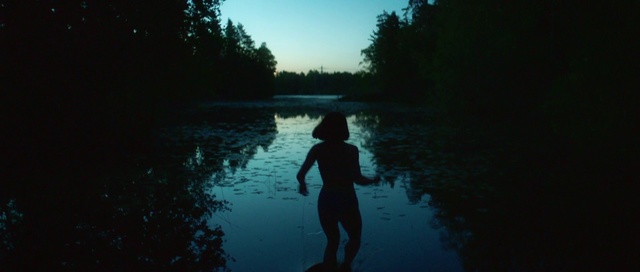 Video Reference: Water, Blue, Reflection, Sky, Natural landscape, River, Darkness, Tree, Photography, Sunlight, Person, Outdoor, Man, Dark, Swimming, Holding, Standing, Lake, Walking, Sun, Body, Boat, Riding, Large, Sunset, Covered, Hill, Flying, Water sport, Sport, Nature