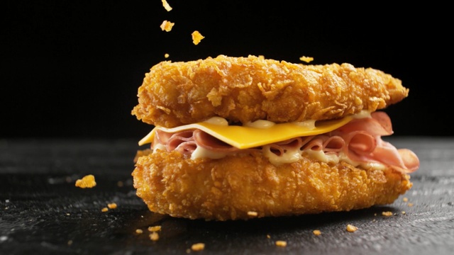 Video Reference: cheeseburger, sandwich, hamburger, snack food, dish, meal, meat, bread, cheese, delicious, dinner, lunch, snack, beef, Person