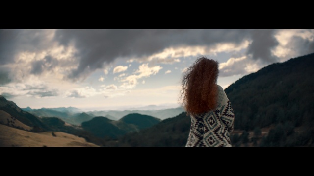 Video Reference: People in nature, Mountainous landforms, Sky, Nature, Photograph, Mountain, Cloud, Beauty, Highland, Wilderness, Outdoor, Photo, Background, Standing, Clouds, Cloudy, Looking, Field, View, Front, White, Covered, Hill, Large, Sign, Tall, Sheep, Man