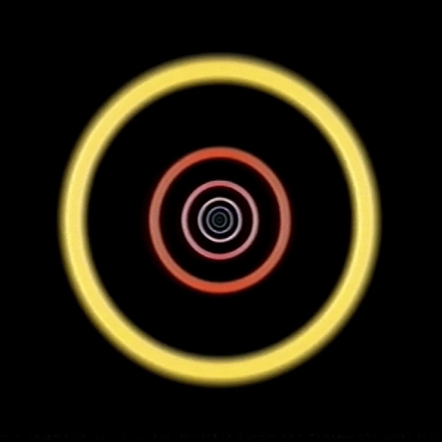 Video Reference: yellow, circle, spiral, computer wallpaper, font, graphics, symbol, Person