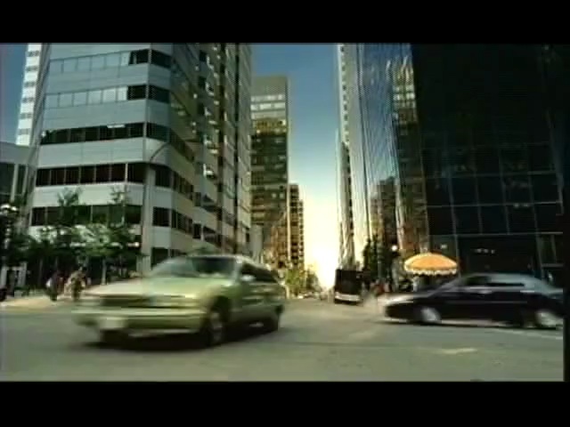 Video Reference: car, metropolitan area, urban area, metropolis, city, luxury vehicle, landmark, family car, skyscraper, transport