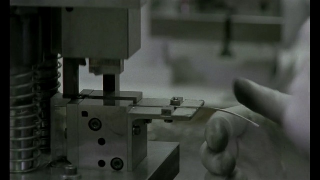 Video Reference: machine, sewing machine, device, home appliance, textile machine, appliance, equipment, Person