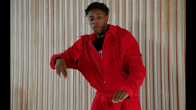 Video Reference: red, outerwear, standing, shoulder, t shirt, fun, Person