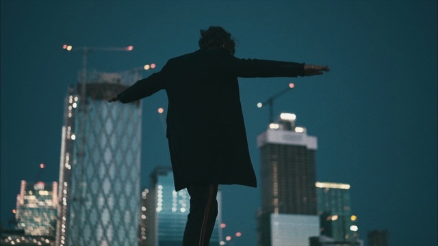 Video Reference: Standing, City, Urban area, Performance, Night, Photography, Screenshot, Metropolis, Skyline