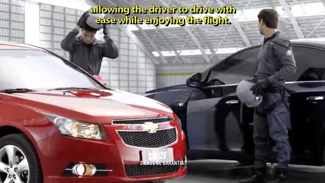 Video Reference: car, motor vehicle, vehicle, chevrolet cruze, mid size car, mode of transport, building, automotive design, vehicle registration plate, bumper, Person