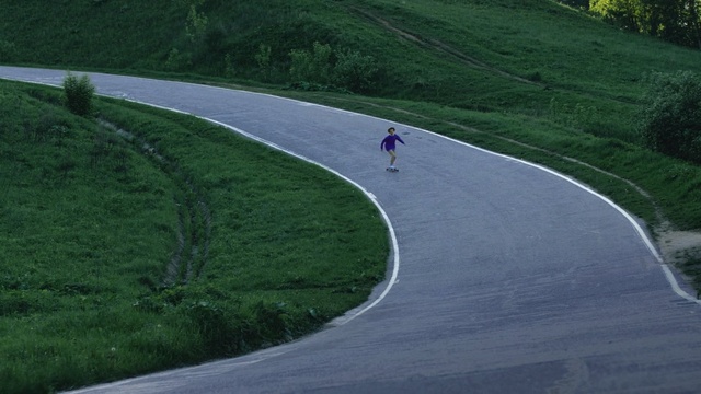 Video Reference: road, path, asphalt, infrastructure, mountain pass, grass, tree, road surface, hill, highway