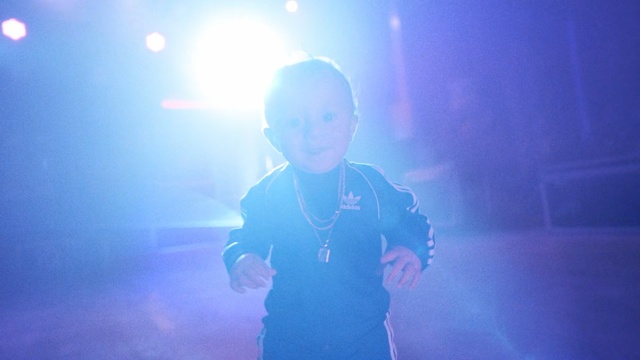 Video Reference: Blue, Sky, Light, Performance, Cloud, Lens flare, Fun, Electric blue, Concert, Performing arts, Person, Man, Holding, Monitor, Front, Standing, Screen, Looking, Water, Cellphone, Dark, Table, Phone, Remote, Glasses, Young, Television, Room, Video, White, Playing, Human face, Clothing, Text, Ocean floor