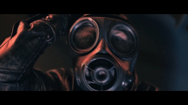 Video Reference: Gas mask, Mask, Personal protective equipment, Costume, Headgear, Font, Photography, Eyewear, Still life photography, Darkness, Indoor, Man, Glasses, Looking, Front, Camera, Sitting, Photo, Wearing, Computer, Black, Goggles, Laptop, Dark, Dog, Close, Standing, Red, Table, Desk, Mirror, Holding, Sunglasses, Screenshot, Spectacles, Staring