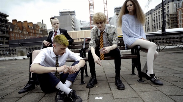 Video Reference: sitting, street, vehicle, road, human behavior, suit, Person