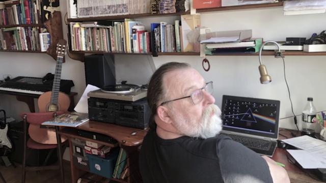 Video Reference: Glasses, Furniture, Bookcase, Computer, Shelf, Personal computer, Laptop, Shelving, Table, Input device