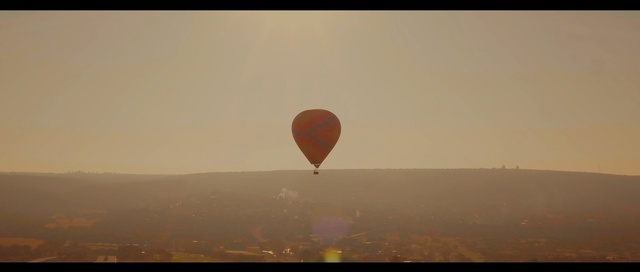 Video Reference: hot air ballooning, hot air balloon, sky, morning, atmosphere, air sports, daytime, sunrise, adventure, landscape, Person
