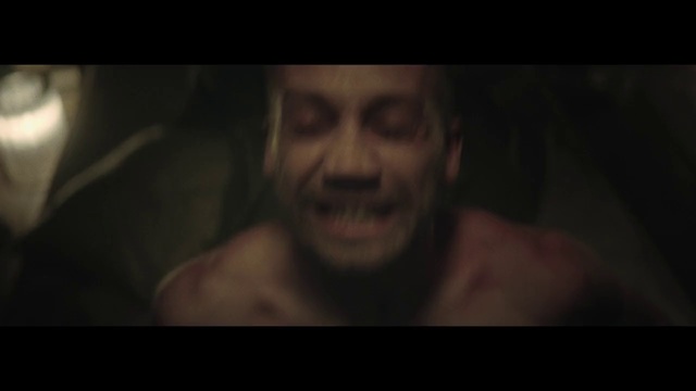 Video Reference: Face, Black, Facial expression, Head, Darkness, Nose, Human, Fiction, Mouth, Barechested