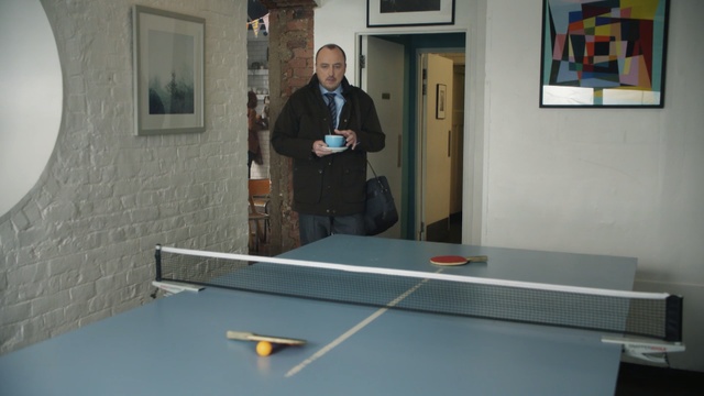 Video Reference: furniture, floor, table, flooring, glass, material, product, Person