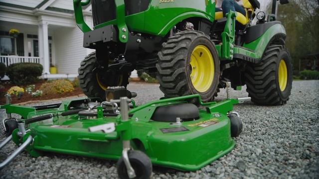 Video Reference: Land vehicle, Vehicle, Tractor, Agricultural machinery, Motor vehicle, Riding mower, Lawn, Tire, Automotive tire, Mower