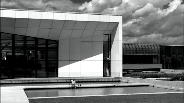 Video Reference: black and white, landmark, monochrome photography, infrastructure, architecture, structure, photography, urban area, sky, monochrome, Person