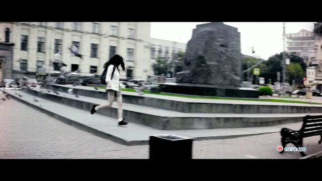 Video Reference: Photograph, Urban area, Snapshot, Human settlement, City, Public space, Town, Skateboard, Metropolitan area, Black-and-white, Person, Building, Outdoor, Road, Bench, Riding, Man, Black, Board, Trick, Rail, Sitting, Doing, Park, Young, Street, Wearing, Ramp, Woman, White, Train, Bus, People, Skating, Statue, Clothing, Text, Footwear