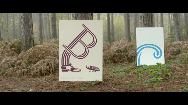 Video Reference: text, advertising, grass, tree, sign, signage, font, brand
