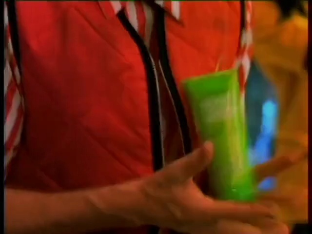 Video Reference: green, red, blue, clothing, yellow, rubik's cube, textile, glass, light, hand
