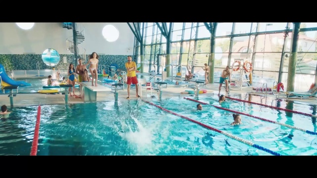 Video Reference: Swimming pool, Leisure centre, Swimming, Leisure, Recreation, Sports, Swimmer, Water sport, Individual sports, Fun, Person, Sport, Indoor, Game, Man, Table, Window, Water, Dog, Holding, Riding, Young, Large, Woman, Standing, Boy, Playing, Blue, Covered, Room, Display, White, Boat, Pool