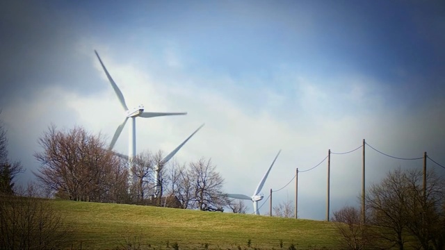 Video Reference: wind farm, wind turbine, windmill, sky, wind, grassland, energy, field, atmosphere, meadow, Person