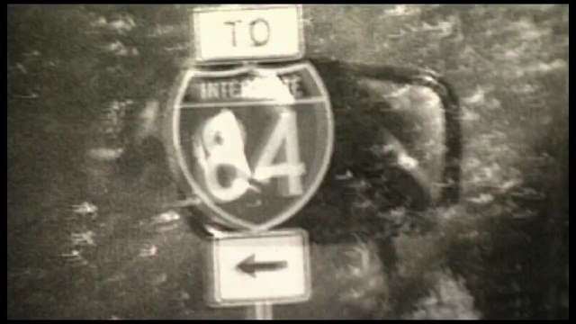 Video Reference: black and white, mode of transport, font, monochrome, monochrome photography, automotive exterior, vehicle registration plate, Person